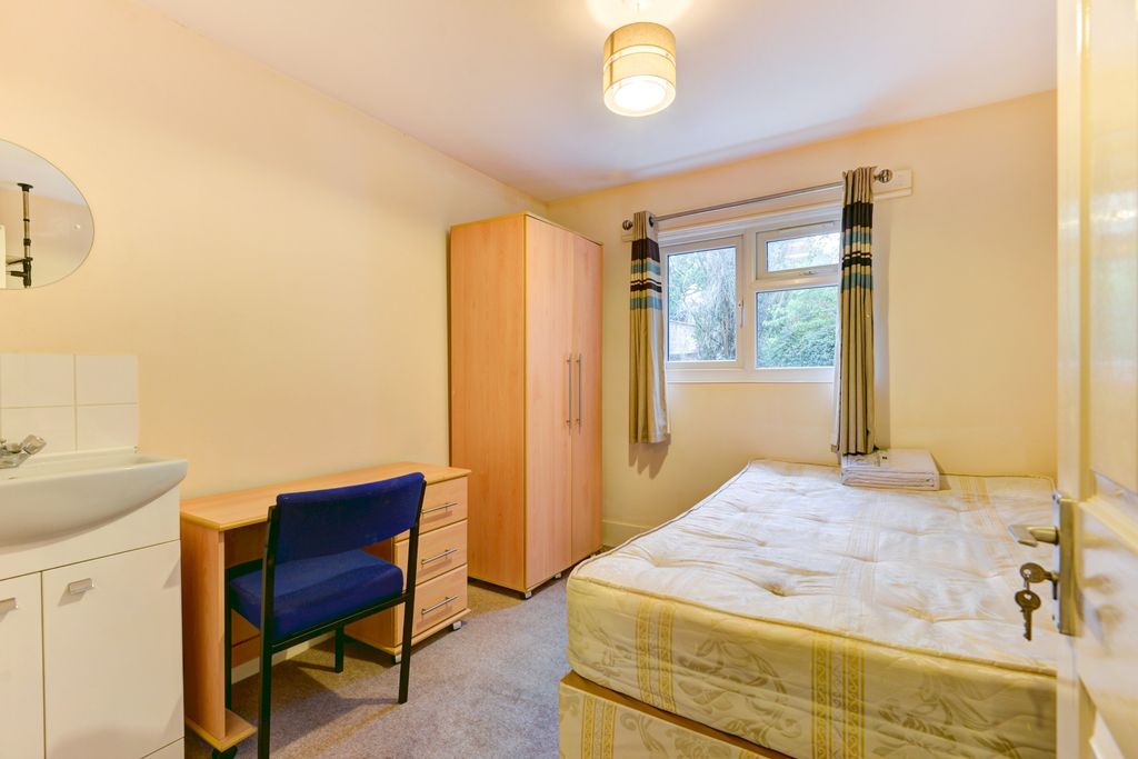 Property photo 3 of 18 Light-Filled Bedroom Featuring A Comfortable Bed A...