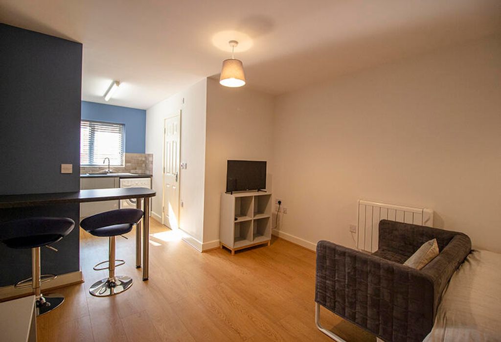 Property photo 3 of 5 Bright And Inviting Living Room Featuring Modern F...