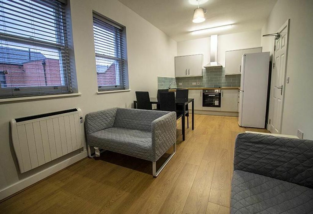 Property photo 1 of 6 A Modern And Inviting Living Room Space Featuring ...