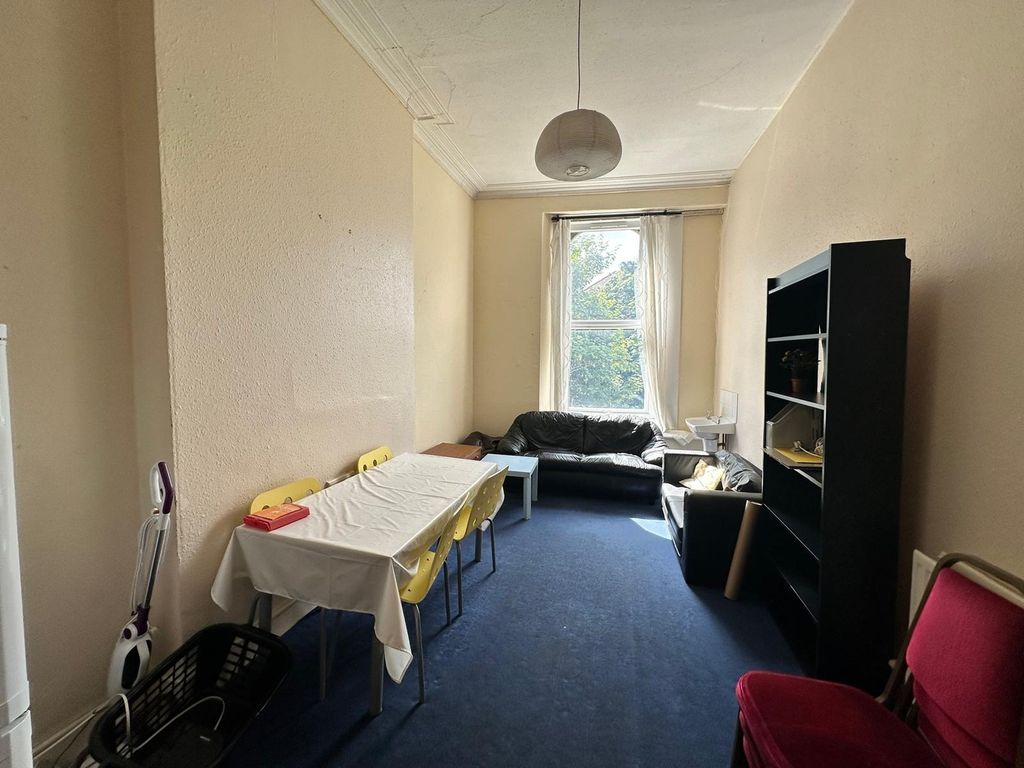 Property photo 1 of 15 A Spacious And Bright Living Room With Ample Seati...