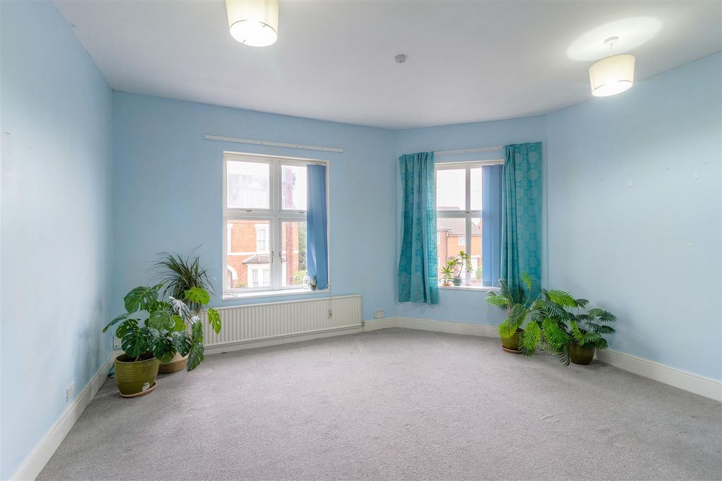 Property photo 1 of 8 Wellingborough Road - Living Room