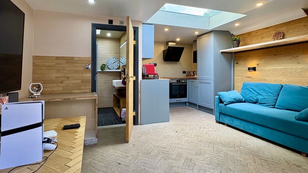 Property photo 2 of 11 Bright Modern Lounge With Skylight And Sleek Sofa...