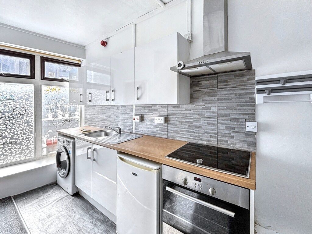 Property photo 2 of 6 Bright Modern Galley Kitchen With White Cabinets, ...