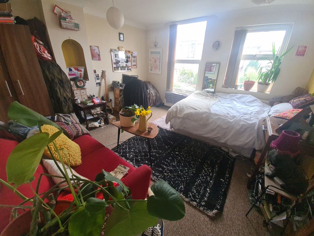 Property photo 3 of 12 Bright And Inviting Master Bedroom Featuring A Com...