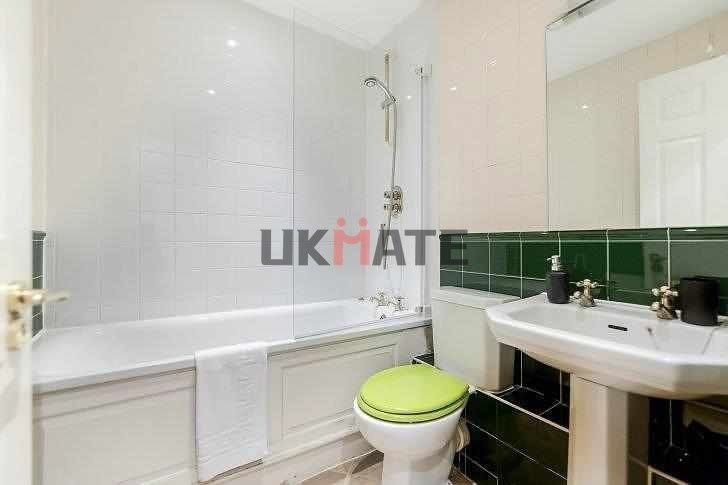 Property photo 2 of 5 A Clean And Bright Bathroom Featuring A Bathtub Wi...