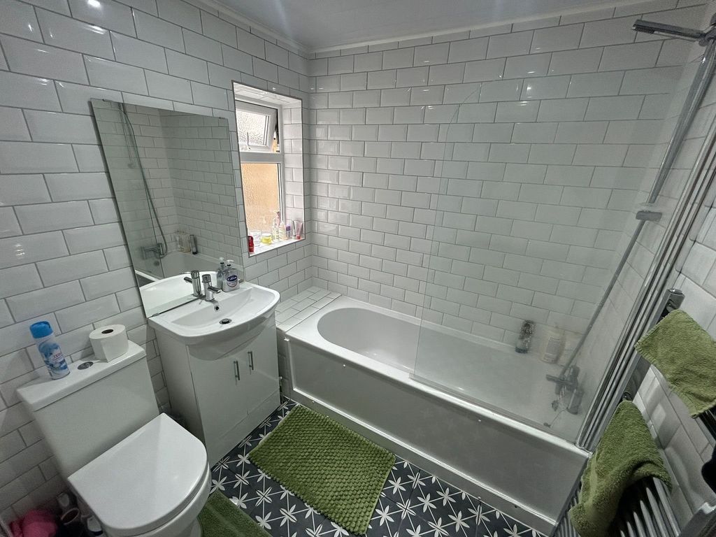 Property photo 2 of 15 Bright And Modern Bathroom Suite Featuring A White...