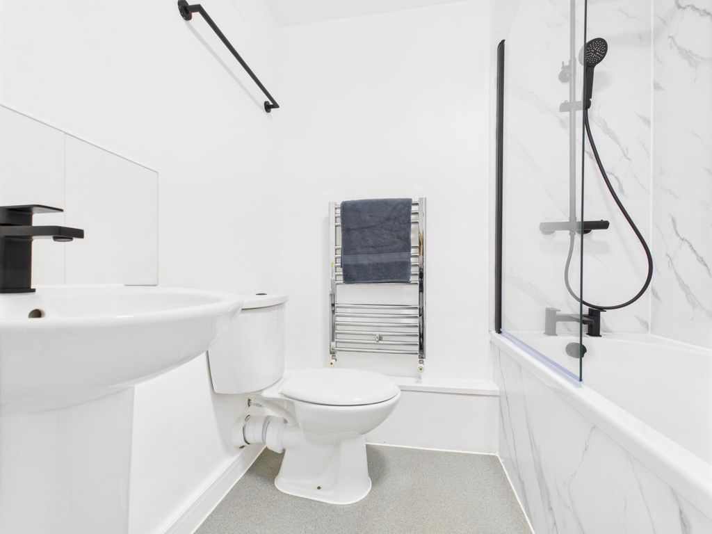 Property photo 2 of 3 Bright, Modern Bathroom With White Fixtures, A Com...