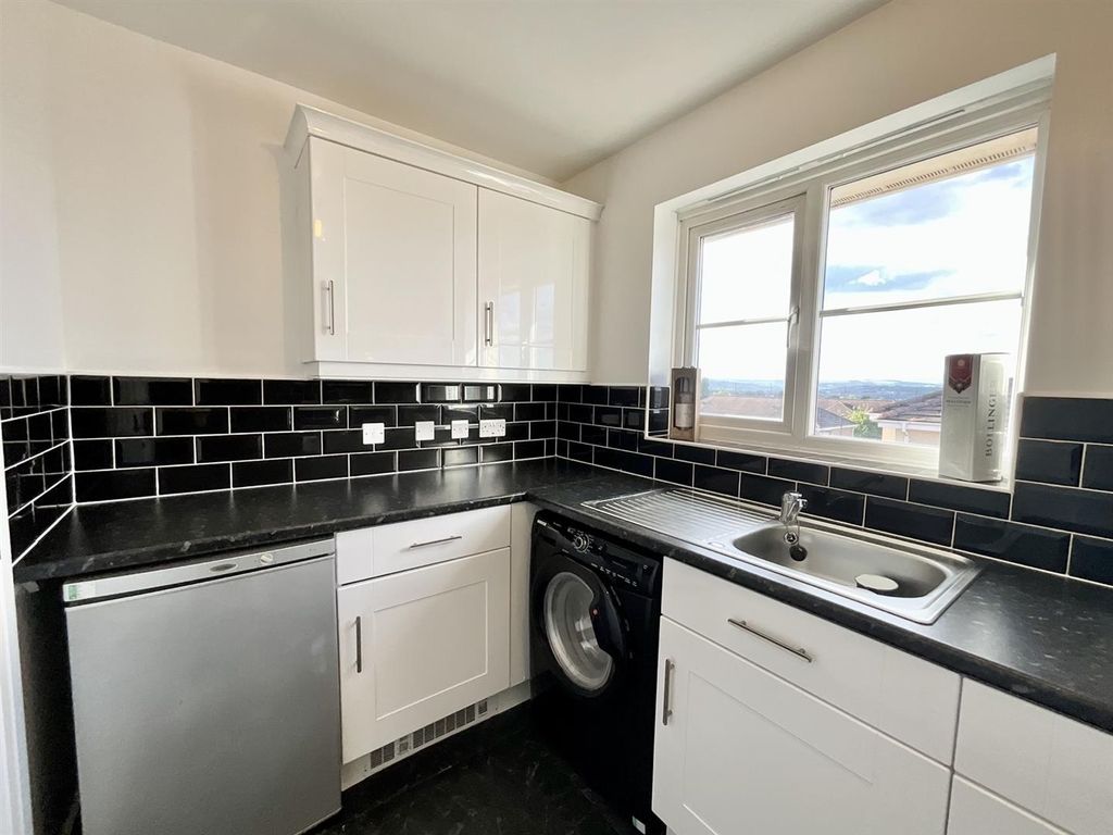 Property photo 3 of 12 Sleek Modern Kitchen With Stylish Black Tiling...
