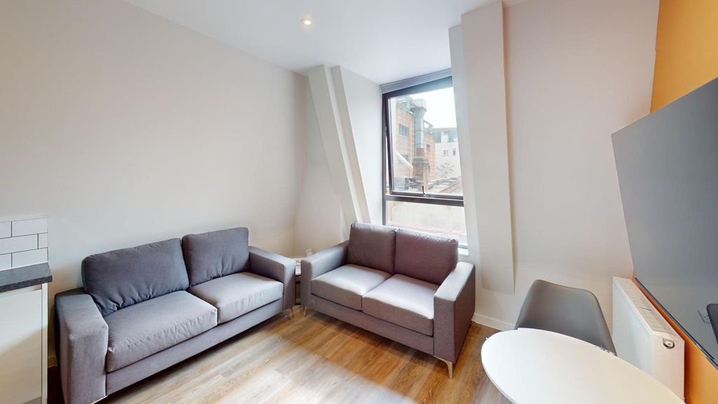 Property photo 2 of 12 A Spacious And Inviting Modern Living Room, Perfec...