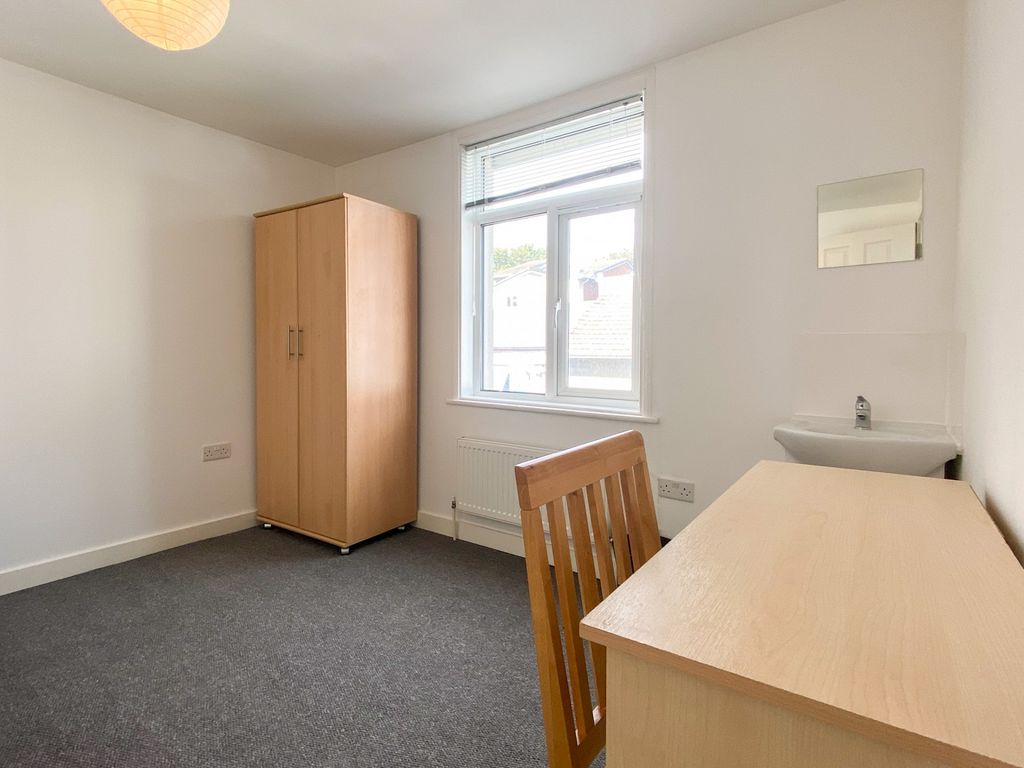 Property photo 3 of 20 A Bright And Tidy Bedroom Featuring A Wooden Wardr...