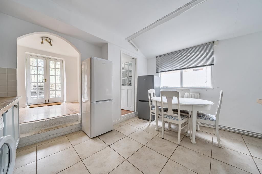 Property photo 3 of 21 Kitchen/Dining Room Leading To Sun Room
