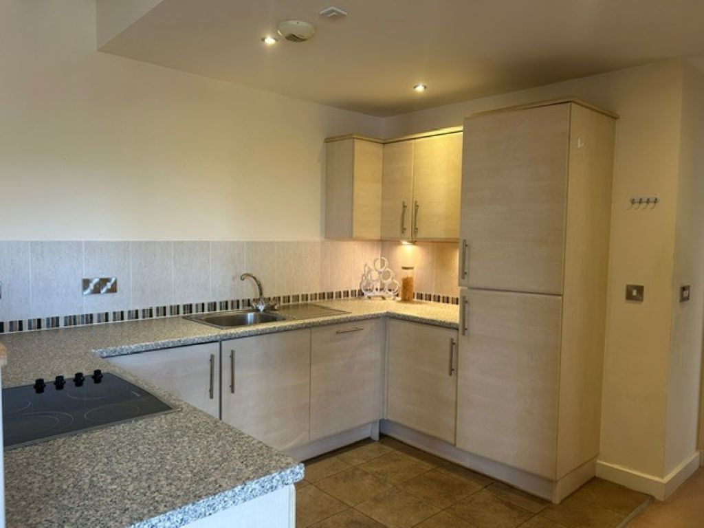 Property photo 2 of 12 Kitchen Area: