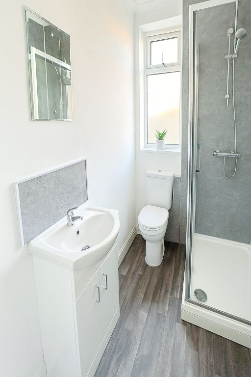 Property photo 1 of 6 Bright And Clean Bathroom Featuring A Modern Showe...