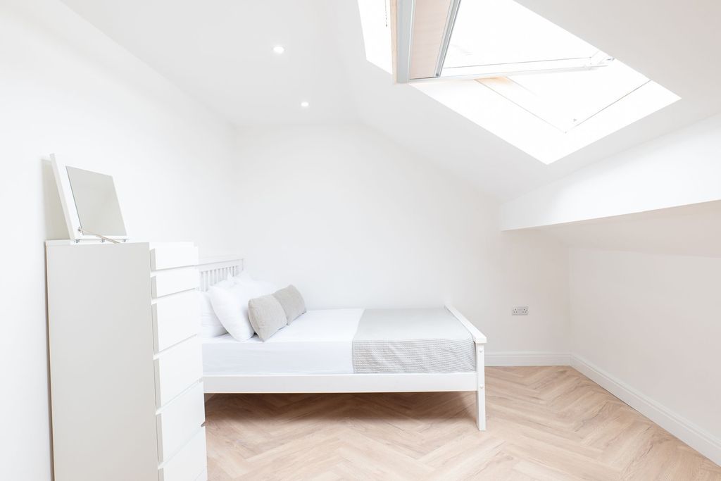Property photo 2 of 11 Bright And Airy Bedroom Featuring A Comfortable Be...
