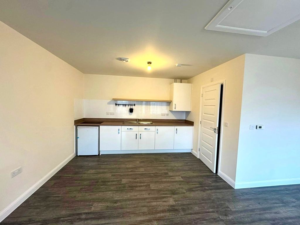 Property photo 1 of 4 Kitchen Area