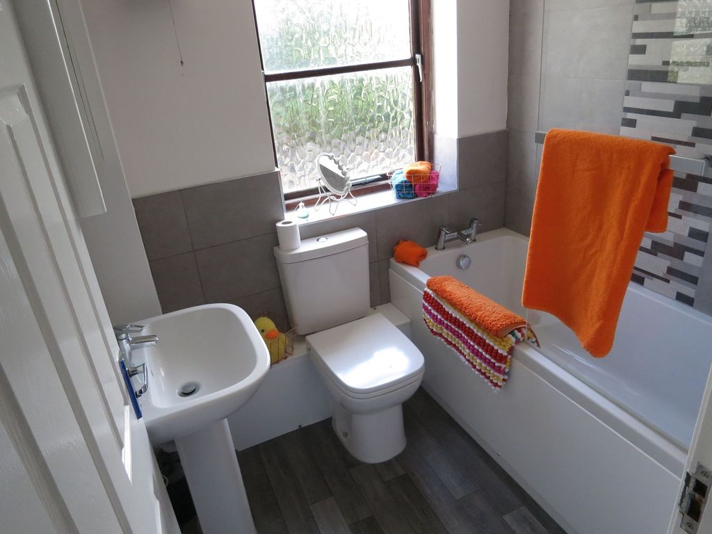 Property photo 3 of 9 Bright And Clean Bathroom Featuring A Bathtub With...