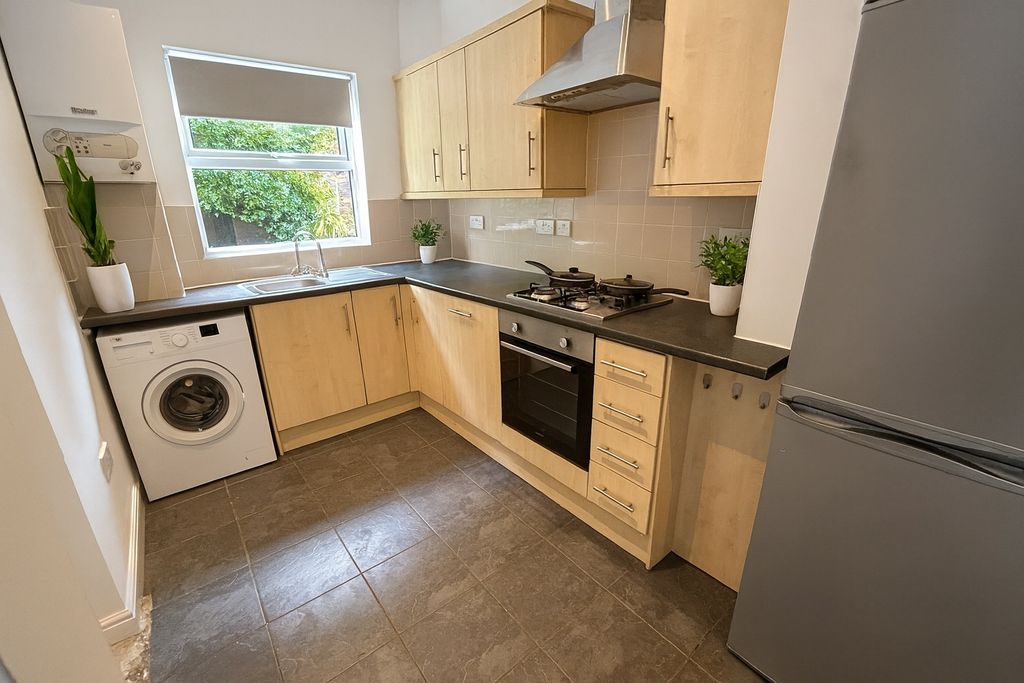 Property photo 1 of 6 A Bright And Clean Kitchen Featuring Wooden Cabine...