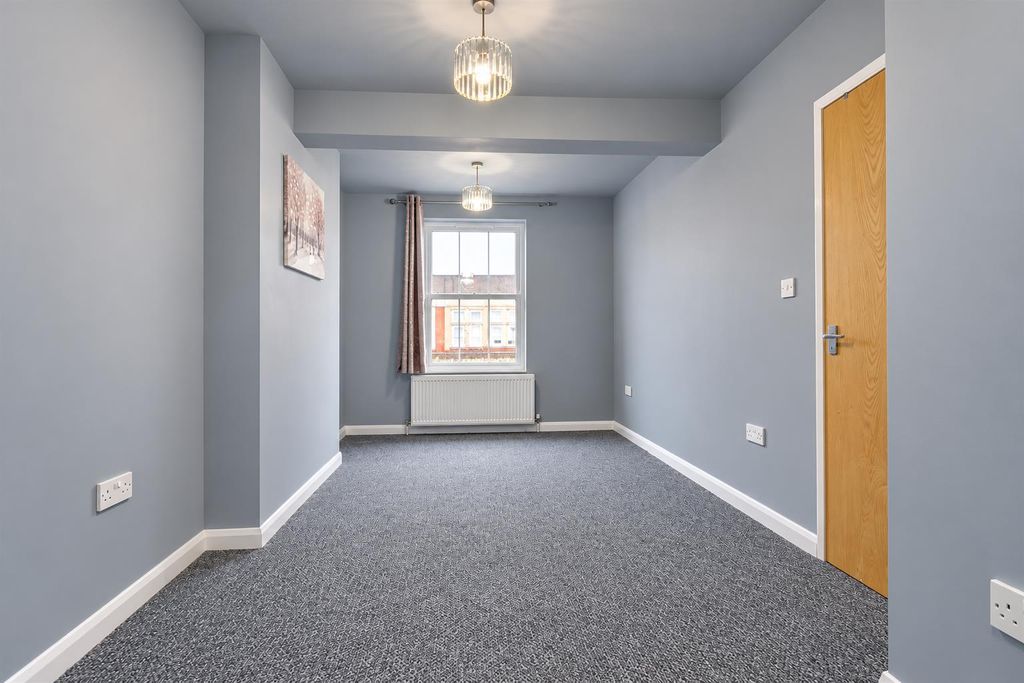 Property photo 2 of 7 Bright Grey Interior With Window View.Png