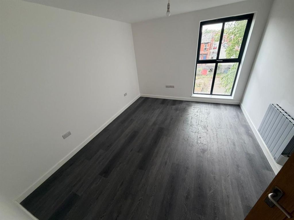 Property photo 3 of 4 Bright Bedroom With Sleek Modern Flooring...