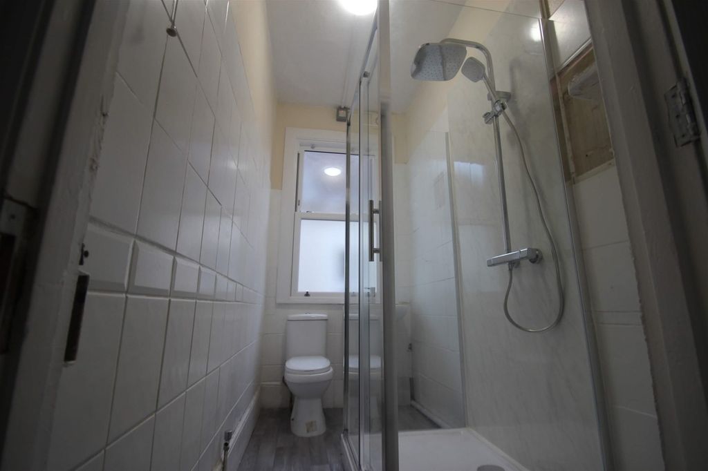 Property photo 2 of 5 This Modern Bathroom Features A Stylish Shower Are...