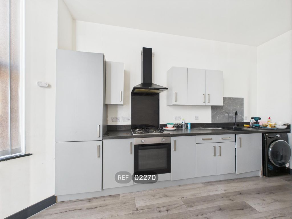 Property photo 3 of 11 Kitchen & Living Area