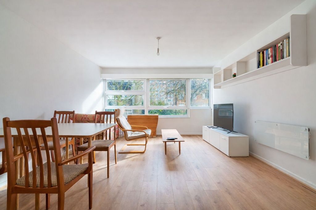 Property photo 2 of 11 Bright And Spacious Living Room With Tree-Lined Outlook