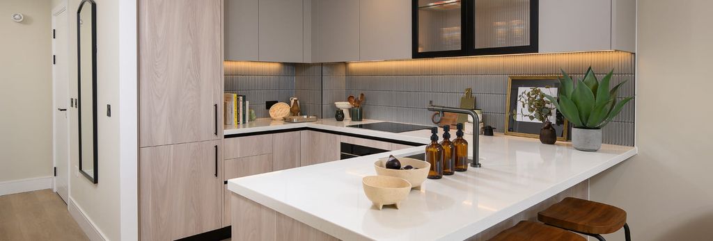 Property photo 2 of 6 Kitchenette With Attached Breakfast Island, Beige Surfaces And White Countertops