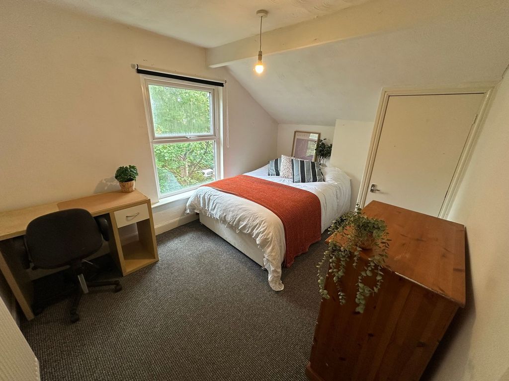 Property photo 1 of 23 A Bright, Well-Maintained Bedroom Featuring A Comf...