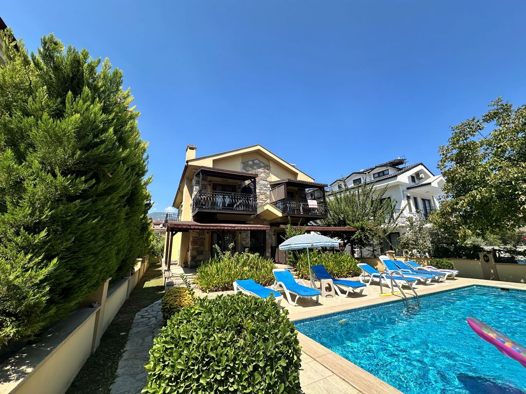 Property photo 2 of 18 A Delightful First-Floor Apartment In Dalyan For Sale - Communal Pool And Pretty Mature Social Garden
