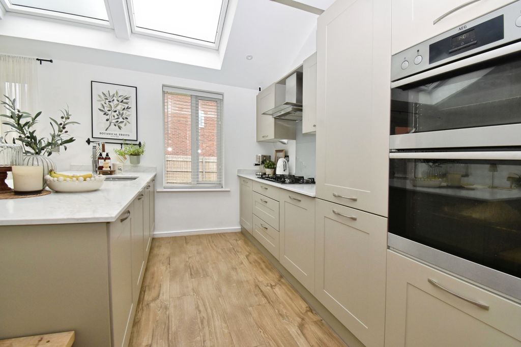 Property photo 2 of 12 Kitchen Area