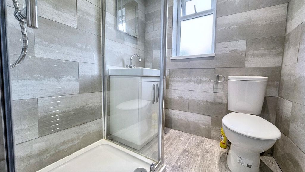 Property photo 1 of 8 Modern Tiled Bathroom With Sleek Walk-In Shower...