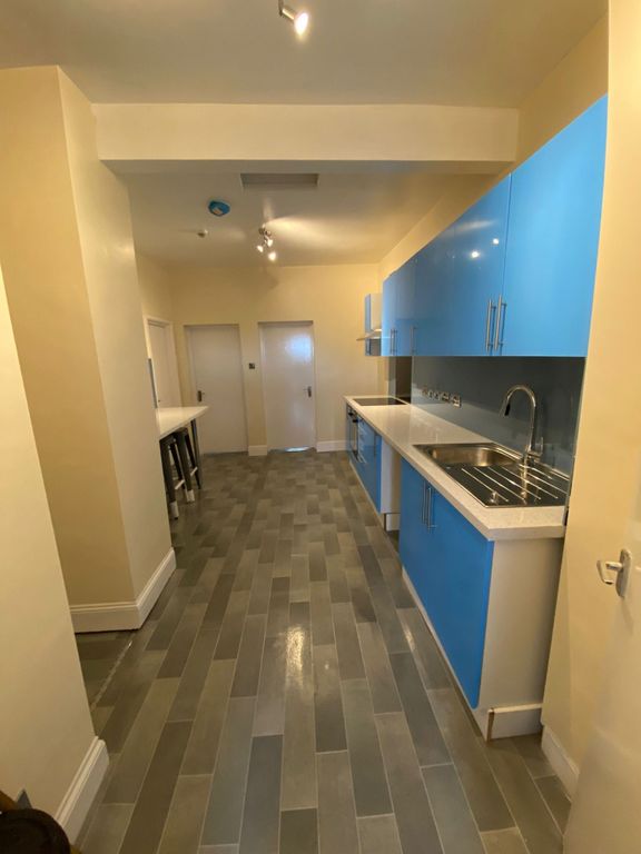 Property photo 2 of 11 Modern Kitchen With Vibrant Blue Cabinetry...