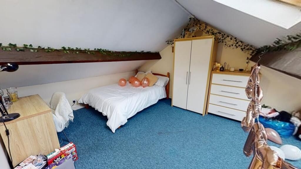 Property photo 1 of 7 Cozy Attic Bedroom Featuring A Single Bed, Wardrob...