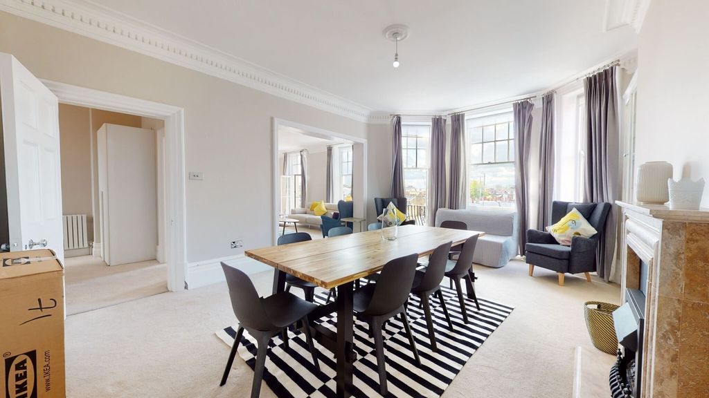 Property photo 2 of 31 Bright And Spacious Living Room Featuring Large Ba...