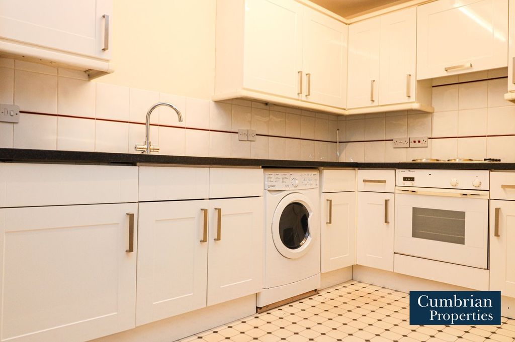 Property photo 2 of 12 Kitchen Area