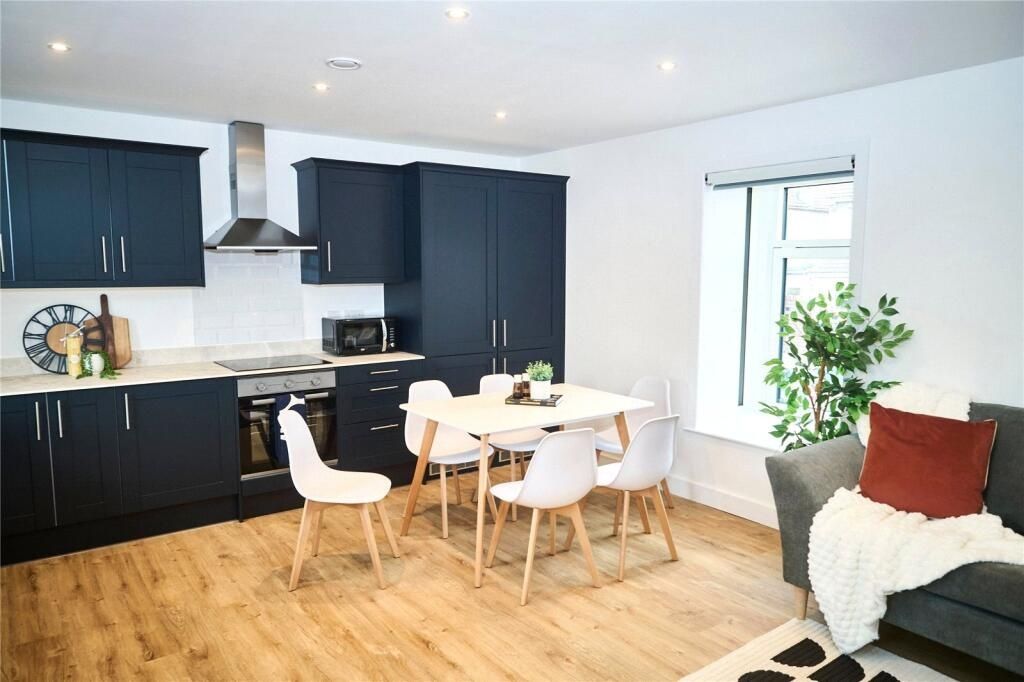 Property photo 2 of 13 A Modern Kitchen With Sleek Black Cabinetry And In...