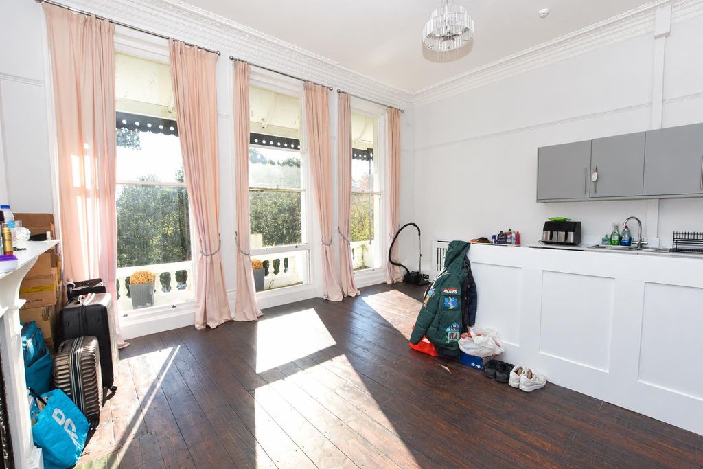 Property photo 3 of 10 Sunlit Victorian Apartment Interior.Png
