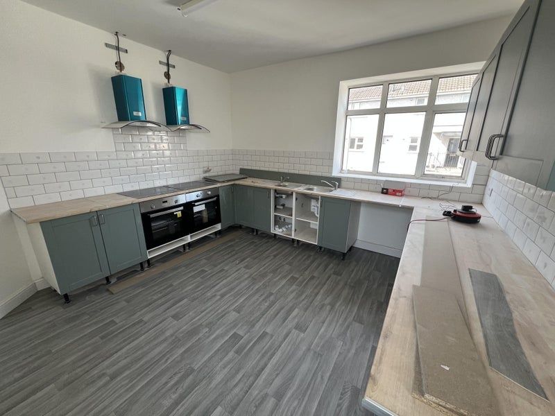 Property photo 2 of 8 Bright And Spacious Kitchen Featuring Modern Cabin...