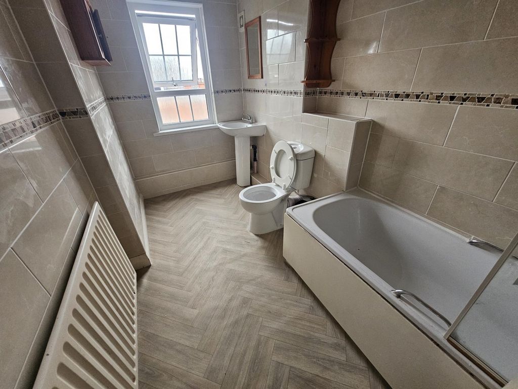 Property photo 1 of 11 Bright, Modern Bathroom With Tiled Walls, A Bathtu...