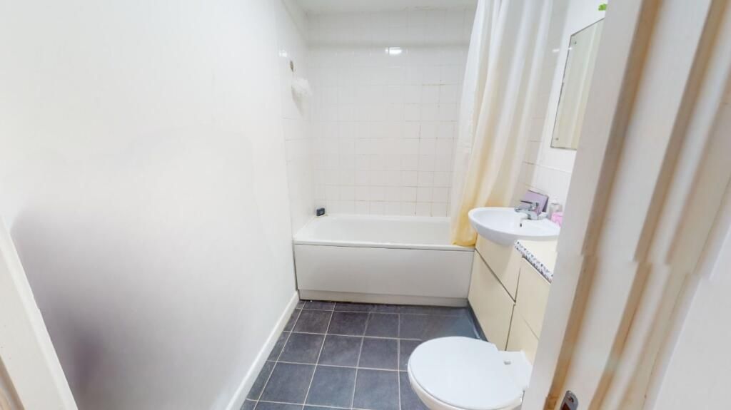 Property photo 3 of 5 A Bright And Clean Bathroom Featuring A Large Bath...