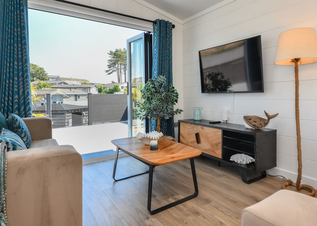 Property photo 3 of 9 Bright Lounge With Bi Fold Doors And Coastal Style Decor