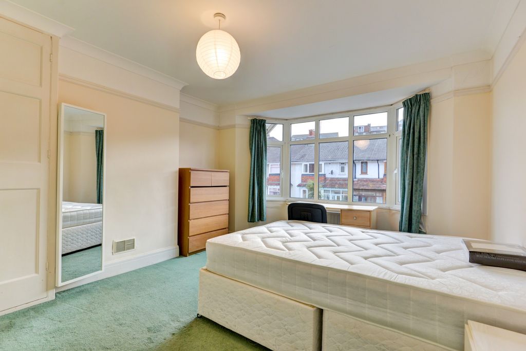 Property photo 2 of 18 Bright And Inviting Master Bedroom Featuring A Lar...