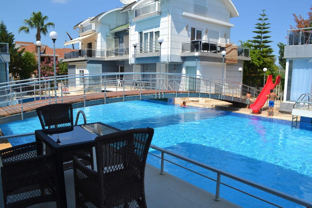 Property photo 1 of 16 A Modern Triplex Villa For Sale In Belek, Antalya - Communal Swimming Pool And Sun Terraces