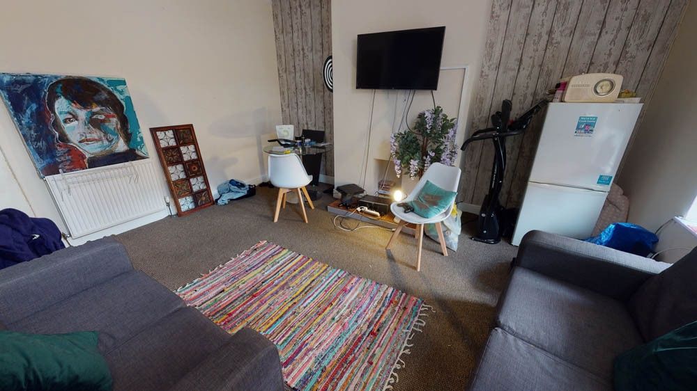 Property photo 3 of 4 A Contemporary Living Room Featuring A Large Sofa,...