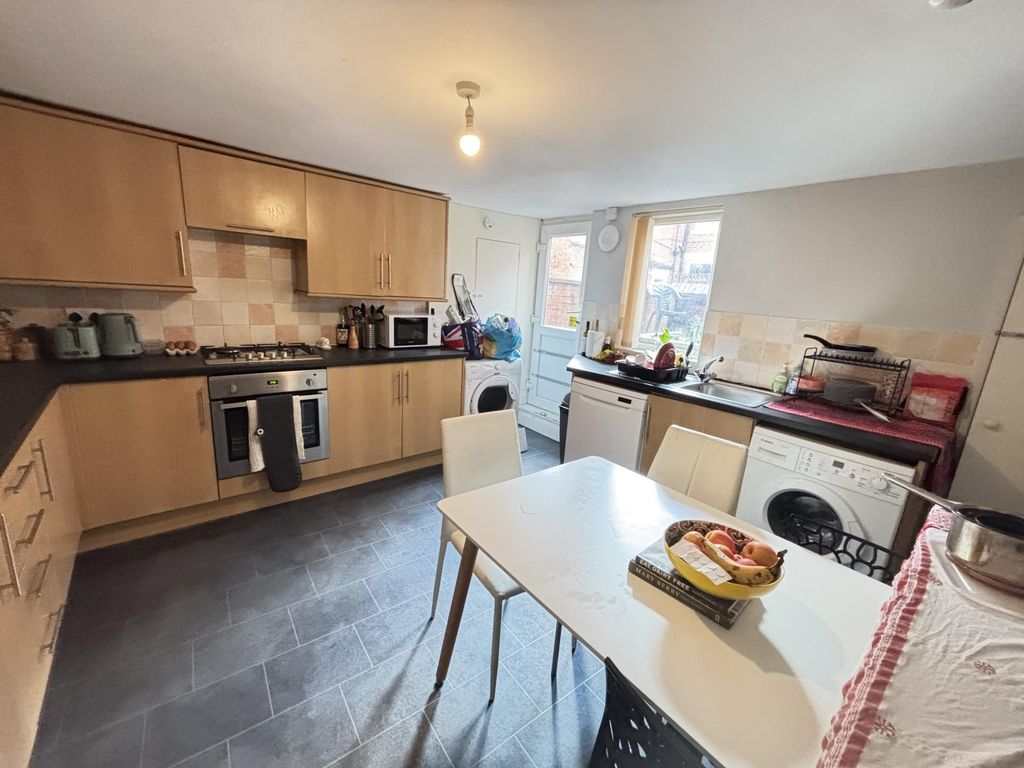 Property photo 3 of 15 A Bright And Modern Living Room Featuring Ample Na...