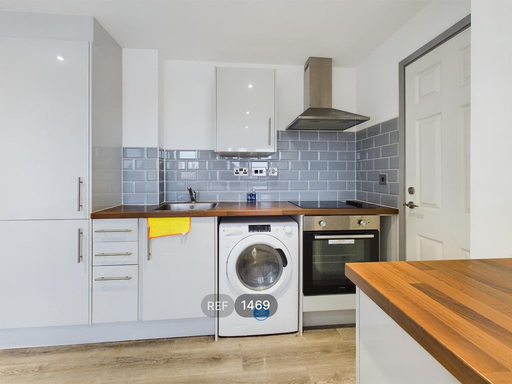 Property photo 2 of 12 Kitchen & Living Area