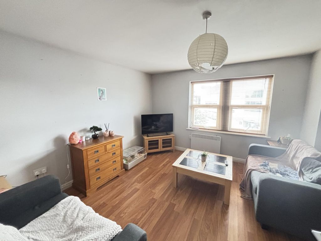 Property photo 2 of 14 A Bright And Inviting Living Room Featuring Large ...