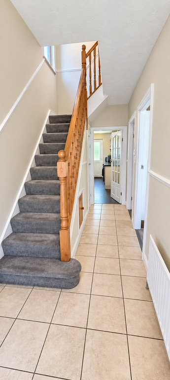 Property photo 2 of 13 Bright Neutral Hallway With Oak Staircase