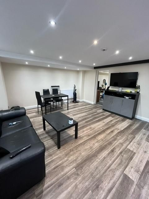 Property photo 1 of 12 Contemporary Open-Plan Living Area With Wood-Effec...