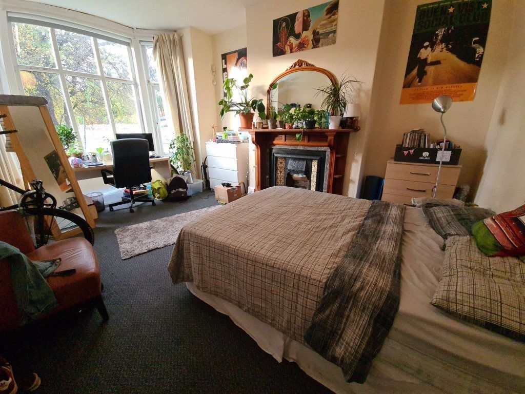 Property photo 1 of 25 A Spacious And Well-Lit Master Bedroom Featuring A...